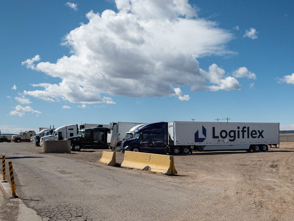 Row of semi trailers parked on a dealer lot