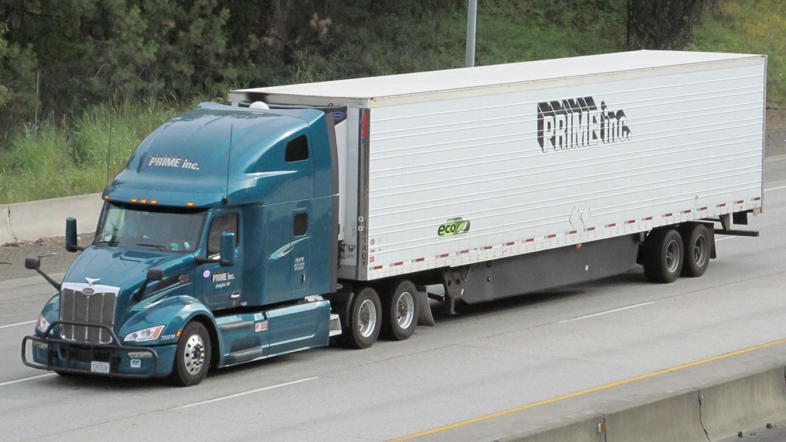 Refrigerated semi trailer being pulled down the interstate